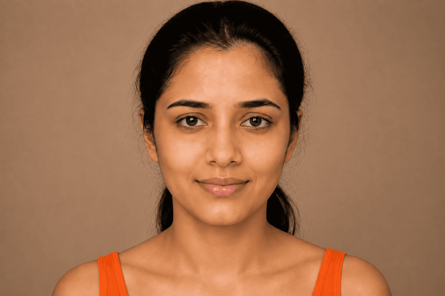 Woman with clear skin after using organic skincare products